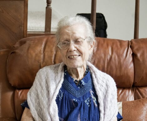 An Elderly Woman Sitting on a Couch in Independent Living Facility in Montgomery AL An Elderly Woman Sitting on a Couch in Independent Living Facility in Montgomery AL