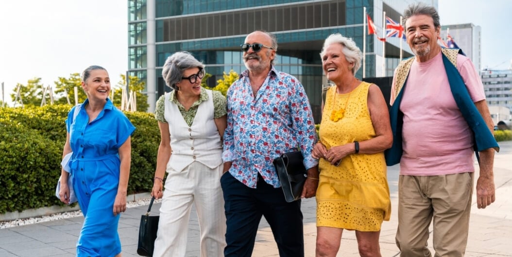 Group of Seniors Walking Together in a City at an Independent Living Facility