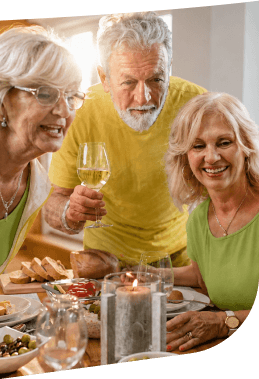 Elderly Friends Sharing Wine and Appetizers at a Dinner in Independent Living