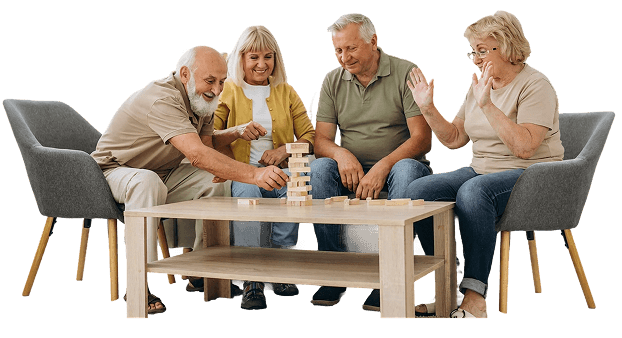 Four Elderly Friends Playing a Block Stacking Game at an Independent Living Facility